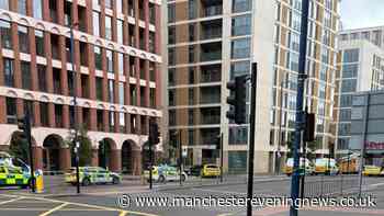 Man rescued 'from height' in Manchester city centre as emergency services rush to incident