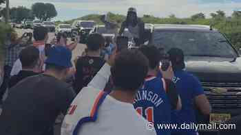 NBA champion Knicks receive a heroes' welcome in New York as jubilant players hang out of car windows after all-night party