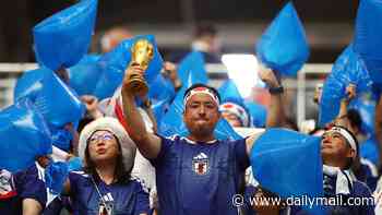 The REAL heroes of the World Cup: Classy Japan fans clean up after themselves following draw against the Netherlands