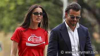 Indy Clinton shocks onlookers as she arrives at Supreme Court of New South Wales in X-rated T-shirt alongside husband and lawyer
