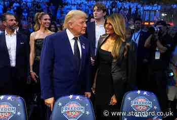 Barron Trump towers above parents Donald and Melania as 20-year-old takes in White House UFC cage fight