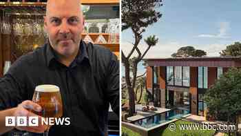 Barman raises a glass after £3.5m Omaze house win
