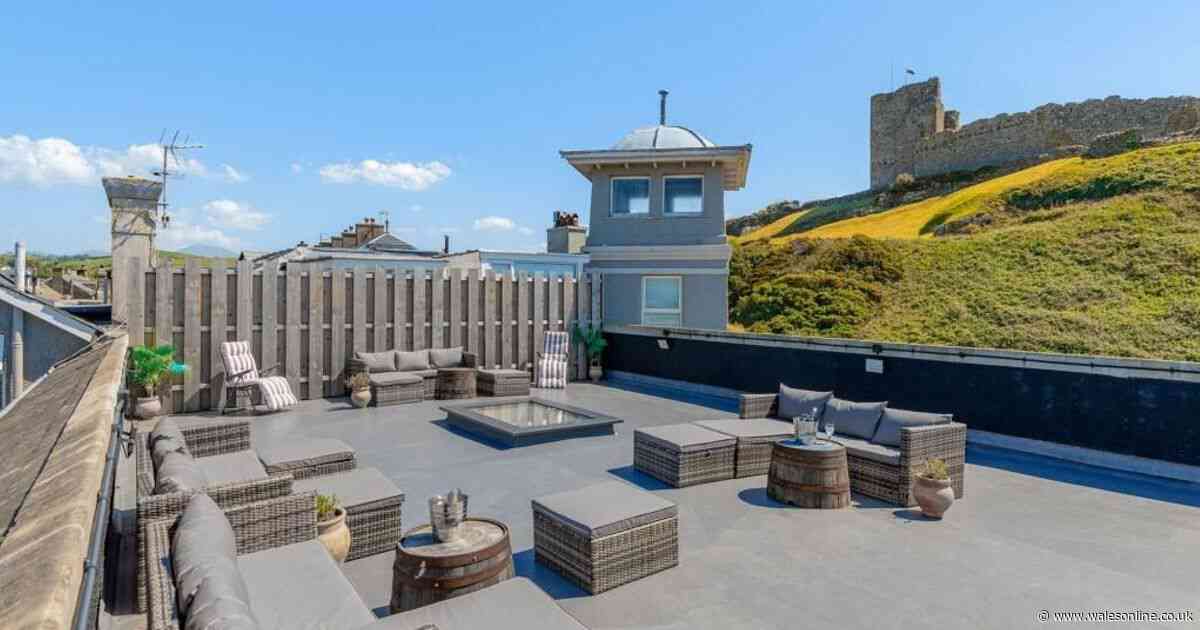 Between the sea on one side and a castle on the other is a house with surely the best rooftop terrace in Wales