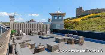 Between the sea on one side and a castle on the other is a house with surely the best rooftop terrace in Wales