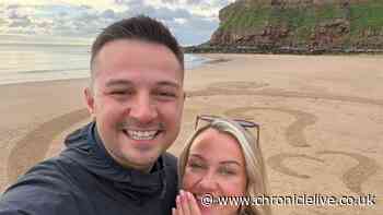 Husband-to-be proposes to partner on Tynemouth beach with engagement ring shaped sand art