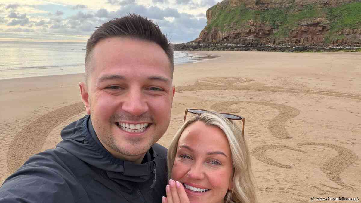 Husband-to-be proposes to partner on Tynemouth beach with engagement ring shaped sand art