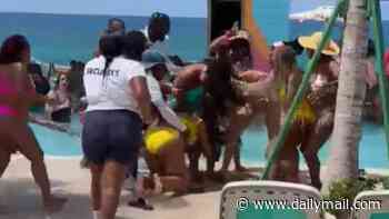 Shocking moment bikini-clad women's poolside dispute descends into full-blown fighting match at exclusive Bahamas beach club