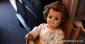 Inside Northumberland Haunted Museum with coffin and room filled with dolls