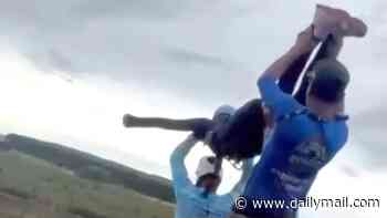 Bungee jump instructors 'removed GoPro camera from body of woman after hurling her off a bridge without a rope attached', witness claims