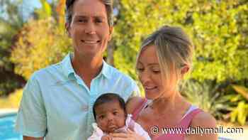 Couple who were implanted with another family's embryo in IVF mix-up are allowed to keep the child and raise her as their own
