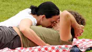 Katy Perry and Justin Trudeau look like lovestruck teenagers as they kiss during romantic picnic date