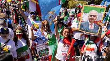 Protesters vow to disrupt Iran's opening World Cup game by turning their backs on the players and booing the national anthem as they gather outside stadium and wave anti-regime flags ahead of kick-off
