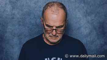 Uruguay manager Marcelo Bielsa refuses to face camera in photoshoot protest, as ex-Leeds boss - who is nicknamed 'El Loco'! - insists that he is 'not a model'