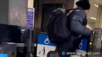 Moment Gucci jacket-wearing fare dodger barges through Tube barriers without paying
