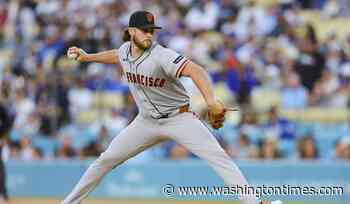 MLB warns Giants pitchers who wrote Bible verses on LGBT Pride hats