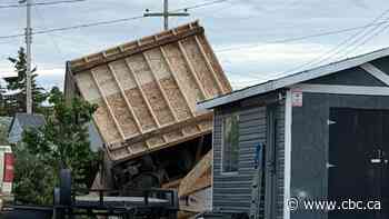 Tornado touches down in northwestern Alberta village, damaging homes and businesses