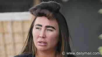 TOWIE's Lauren Goodger sports a crop top as she steps out with her hair in rollers after a spot of pampering