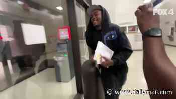 Grinning Kansas City Chiefs star Rashee Rice runs away from cameras as he is released from jail