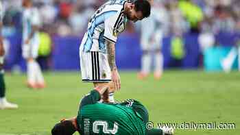 World Cup fans claim the tournament is RIGGED as Lionel Messi avoids a red card after stamping on Algerian rival