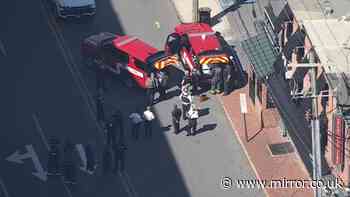 Hospital worker at large after 'shooting two co-workers' - one dead