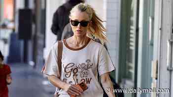 Jackie 'O' Henderson looks dishevelled and reveals her unruly hair extensions while heading to the salon as Kyle Sandilands settles with ARN and her court case rages on