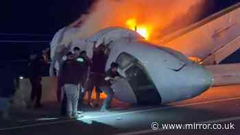 Plane crashes into Texas highway and catches fire with people trapped inside