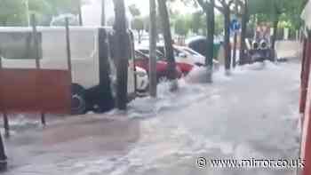 Flash flood chaos in Spanish holiday hotspot as people washed away and cars submerged