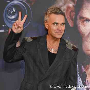 Robbie Williams signs with iconic 90s band's management team and teases 'new chapter'