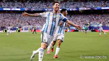 Lionel Messi ties men's World Cup goals record with a hat trick as Argentina tops Algeria