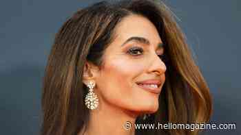 Amal Clooney just wore the slinkiest Prada dress in this season's hottest colour