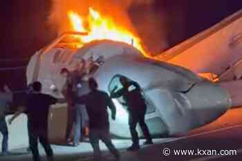 WATCH: People rush to try to help plane crash victims on Texas highway