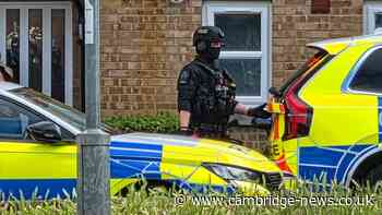 Armed police rush to Cambridge estate after reports of 'threats'
