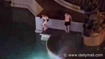 Two men climb into Rome's ancient Fountain of the Naiads before hotel guests spot them in intimate embrace and call cops