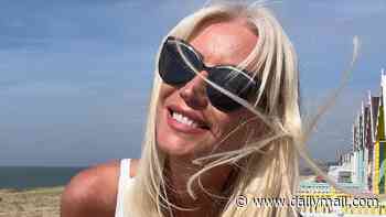 Denise Van Outen, 52, poses in a plunging white bikini as she enjoys a beach day after reclaiming her 'freedom' following 'challenging' times raising daughter Betsy, 16