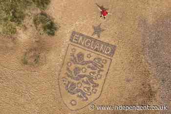 Artist creates 30-foot England badge on Suffolk beach ahead of World Cup clash
