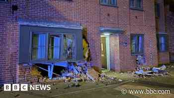 Drink-drive arrest after car crashes into flats