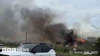 Crews tackle fire in 100 tonnes of household waste