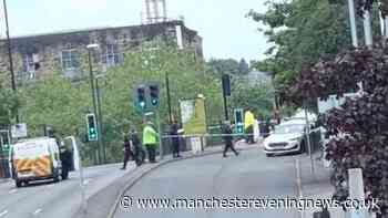Major road in Rochdale closed with emergency services at the scene after child hit by van