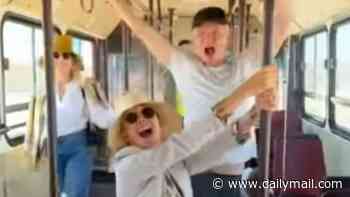 Trudie Styler and husband Sting lark around on public transport in Egypt as they holiday with Bob Geldof