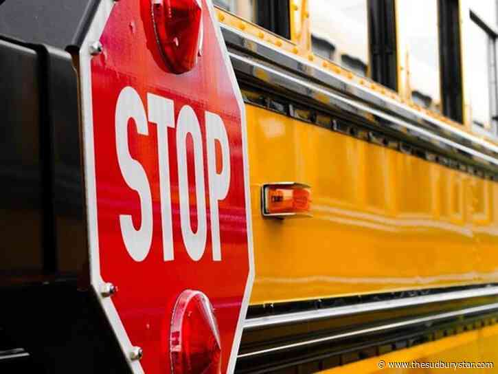 Truck driver charged in school bus collision in Spanish
