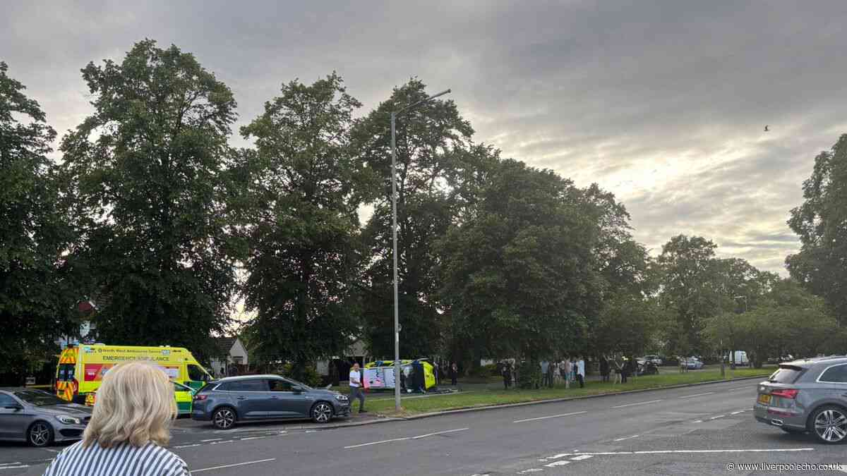 Liverpool main road closed live after police car flips onto side in crash