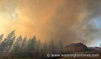 Eastern Washington wildfire forces evacuations and destroys homes