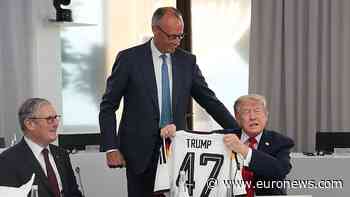Watch: German chancellor surprises Trump with 'Trump 47' football jersey at G7