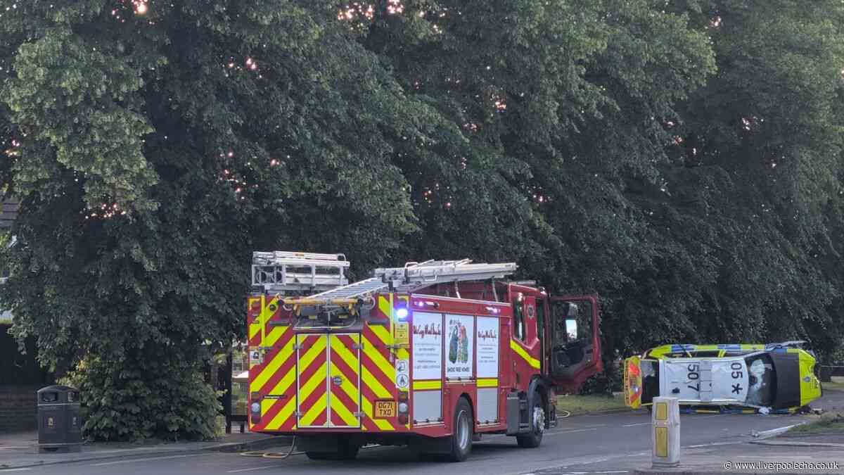 Liverpool main road closed after police car flips onto side in crash- recap