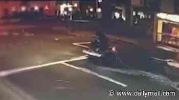 Moment drunk driver catapults motorcyclist into the air while he waits at a red light