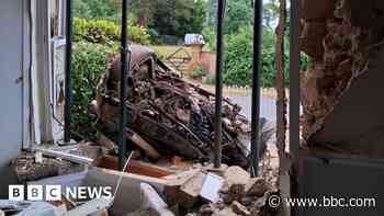 Man charged after car crashes into house