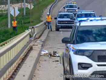 Worker killed after 300-ton crane crashes off bridge into Northern Alberta river