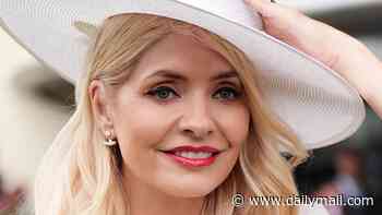 Holly Willoughby displays a naughty message on her phone case as she stuns in white while attending Ladies Day at Royal Ascot