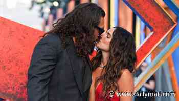 Jason Momoa packs on the PDA with his stunning girlfriend Adria Arjona at the Supergirl premiere - as leading lady Milly Alcock stuns in white dress