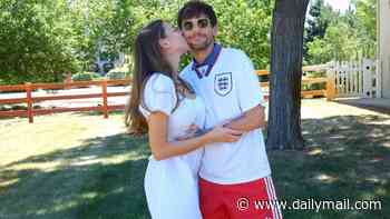 Zara McDermott and Louis Tomlinson put on a loved-up display in cosy snaps as pair support England's World Cup efforts